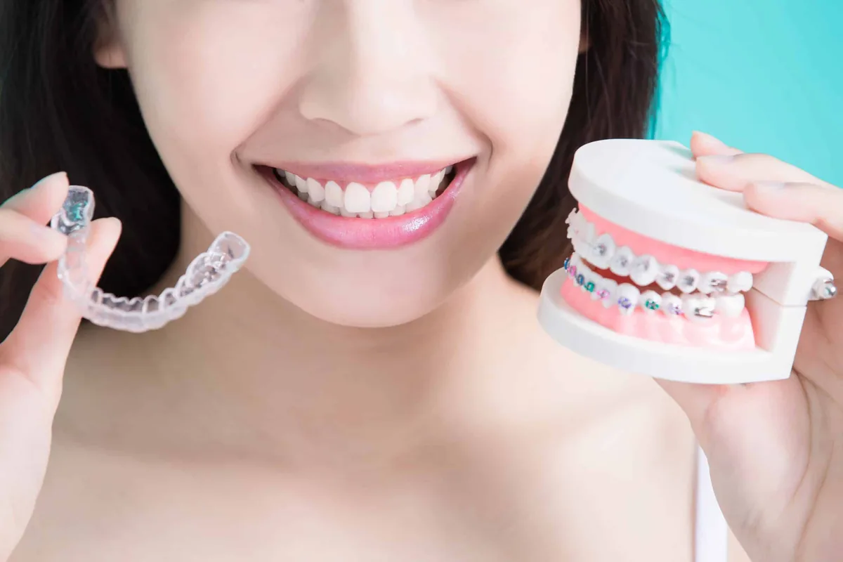 A patient choosing between clear aligners and braces